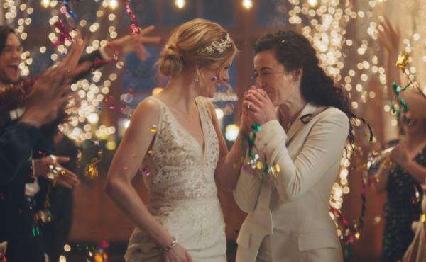 The Hallmark Channel is embroiled in controversy after it pulled an ad by wedding site Zola, which shows a lesbian couple getting married and sharing a kiss. The Hallmark Channel is embroiled in controversy after it pulled an ad by wedding site Zola, which shows a lesbian couple getting married and sharing a kiss.