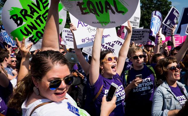 Abortion rights activists celebrate outside the U.S. Supreme Court Monday for a ruling in a case over a Texas law that places restrictions on abortion clinics. Abortion rights activists celebrate outside the U.S. Supreme Court Monday for a ruling in a case over a Texas law that places restrictions on abortion clinics.