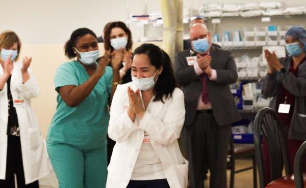 Nurses clap after Kym Villamer and her colleague Dawn Jones sing "Ain't No Mountain High Enough" at New York-Presbyterian Queens Hospital's new COVID-19 ward. Nurses clap after Kym Villamer and her colleague Dawn Jones sing "Ain't No Mountain High Enough" at New York-Presbyterian Queens Hospital's new COVID-19 ward.
