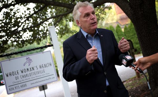 Former Virginia Gov. Terry McAuliffe, a Democrat running for a second term, answers questions from the media after touring Whole Woman's Health of Charlottesville on Sept. 9. He's working to rally voters in response to Texas' restrictive new abortion law. Former Virginia Gov. Terry McAuliffe, a Democrat running for a second term, answers questions from the media after touring Whole Woman's Health of Charlottesville on Sept. 9. He's working to rally voters in response to Texas' restrictive new abortion law.
