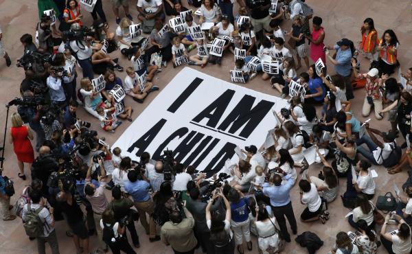 Families with young children protest the separation of immigrant families with a sit-in at the Hart Senate Office Building in Washington last week. Families with young children protest the separation of immigrant families with a sit-in at the Hart Senate Office Building in Washington last week.