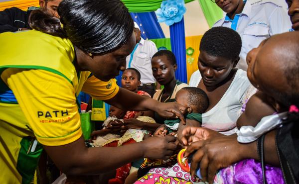 A health worker vaccinates a Kenyan child with the world's first malaria vaccine. Kenya has given at least one dose to 300,000 children so far. A health worker vaccinates a Kenyan child with the world's first malaria vaccine. Kenya has given at least one dose to 300,000 children so far.