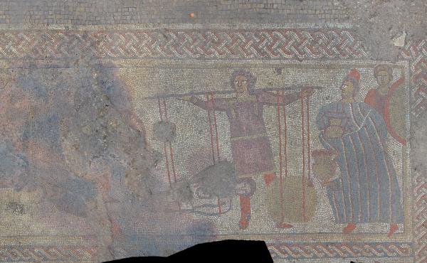 A panel of the mosaic discovered by a team of archaeologists in England. The researchers say it shows the body of Hector returning to his father, King Priam (right), in exchange for his weight in gold. A panel of the mosaic discovered by a team of archaeologists in England. The researchers say it shows the body of Hector returning to his father, King Priam (right), in exchange for his weight in gold.