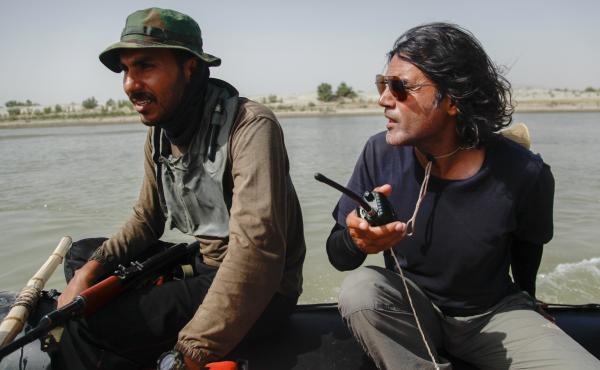 Wajahat Malik, right, and a Pakistan Navy seaman navigate the Indus River. Malik organized a 40-day expedition down the 2,000-mile river to document "the peoples, the cultures, the biodiversity and just whatever comes our way," he says — including the i Wajahat Malik, right, and a Pakistan Navy seaman navigate the Indus River. Malik organized a 40-day expedition down the 2,000-mile river to document "the peoples, the cultures, the biodiversity and just whatever comes our way," he says — including the i