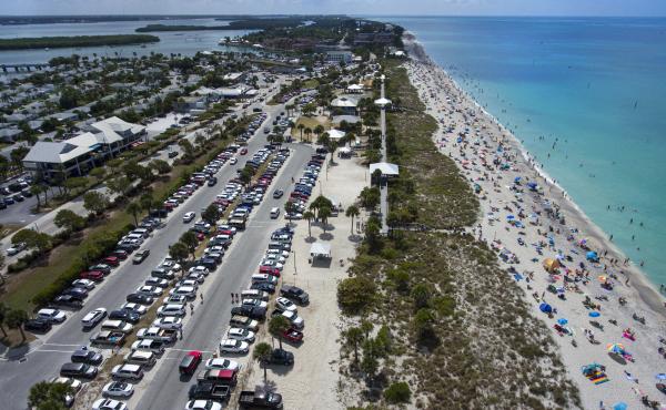 Englewood Beach in Charlotte County, Fla., was crowded on March 20. Public gatherings like these will be prohibited in Florida beginning Thursday. Englewood Beach in Charlotte County, Fla., was crowded on March 20. Public gatherings like these will be prohibited in Florida beginning Thursday.