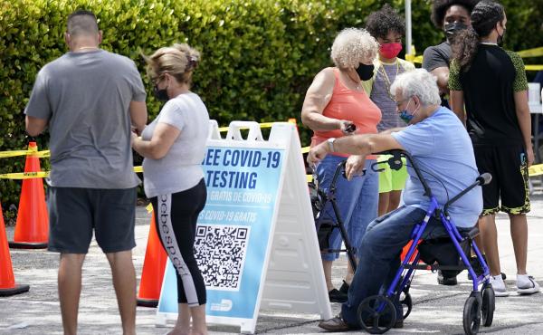 People wait in line at a Miami-Dade County COVID-19 testing site, Monday, July 26, 2021, in Hialeah, Fla. Florida accounted for a fifth of the nation's new infections last week, more than any other state, according to the CDC. People wait in line at a Miami-Dade County COVID-19 testing site, Monday, July 26, 2021, in Hialeah, Fla. Florida accounted for a fifth of the nation's new infections last week, more than any other state, according to the CDC.