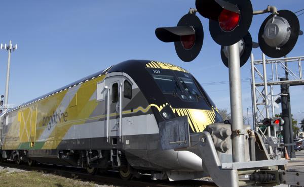 A Brightline train approaches a railroad crossing on Jan. 18, 2018, in Fort Lauderdale, Fla. In its first two years, more than 40 people have been killed by Brightline trains on tracks and at rail crossings. A Brightline train approaches a railroad crossing on Jan. 18, 2018, in Fort Lauderdale, Fla. In its first two years, more than 40 people have been killed by Brightline trains on tracks and at rail crossings.