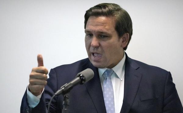 Florida Gov. Ron DeSantis, here during a news conference last month, says his state is ready to respond if a surge of coronavirus infections emerges. Florida Gov. Ron DeSantis, here during a news conference last month, says his state is ready to respond if a surge of coronavirus infections emerges.