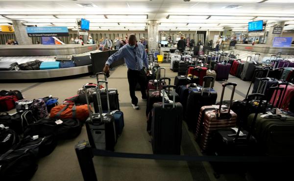 Unclaimed baggage wells up between carousels for passengers arriving on Southwest Airlines flights at Denver International Airport late Sunday, Oct. 10, in Denver. Unclaimed baggage wells up between carousels for passengers arriving on Southwest Airlines flights at Denver International Airport late Sunday, Oct. 10, in Denver.