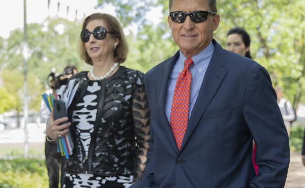 Michael Flynn, President Trump's former national security adviser, leaves federal court with lawyer Sidney Powell in September 2019. Michael Flynn, President Trump's former national security adviser, leaves federal court with lawyer Sidney Powell in September 2019.