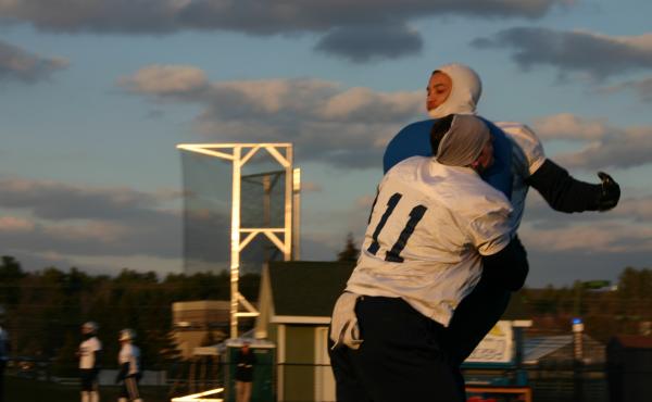 Making and taking a hit chest to chest, instead of skull to skull, is easier to remember if you're not wearing a helmet, say University of New Hampshire Wildcat football players. Making and taking a hit chest to chest, instead of skull to skull, is easier to remember if you're not wearing a helmet, say University of New Hampshire Wildcat football players.