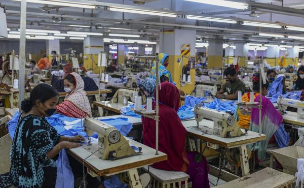Garment workers were deemed essential employees during Bangladesh's lockdown and some resumed work in Dhaka last month. Garment workers were deemed essential employees during Bangladesh's lockdown and some resumed work in Dhaka last month.