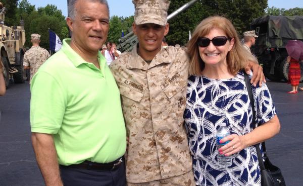 Marine Capt. Cristian Alphonso, center, pictured with his parents, Bonny, left, and Karen, right, in 2014. Alphonso was unable to visit his parents before an upcoming deployment because of Defense Dept. travel restrictions. Marine Capt. Cristian Alphonso, center, pictured with his parents, Bonny, left, and Karen, right, in 2014. Alphonso was unable to visit his parents before an upcoming deployment because of Defense Dept. travel restrictions.