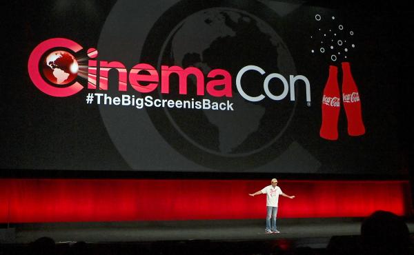 CinemaCon Managing Director Mitch Neuhauser speaks on stage at the 2021 event. CinemaCon Managing Director Mitch Neuhauser speaks on stage at the 2021 event.