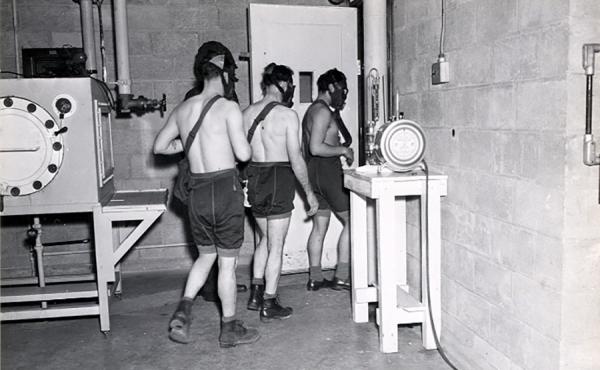 In this 1945 image, test subjects enter a gas chamber for a U.S. military experiment that will expose them to mustard gas. In this 1945 image, test subjects enter a gas chamber for a U.S. military experiment that will expose them to mustard gas.