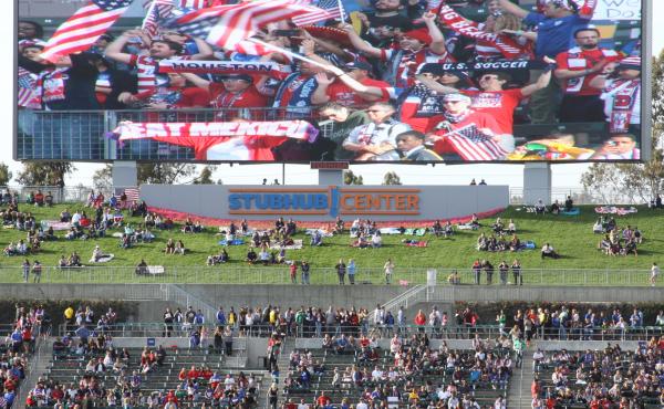 American Outlaws, seen on the big screen, cheer for the U.S. women's national team more than half an hour before kickoff during a match with Mexico on May 17. American Outlaws, seen on the big screen, cheer for the U.S. women's national team more than half an hour before kickoff during a match with Mexico on May 17.