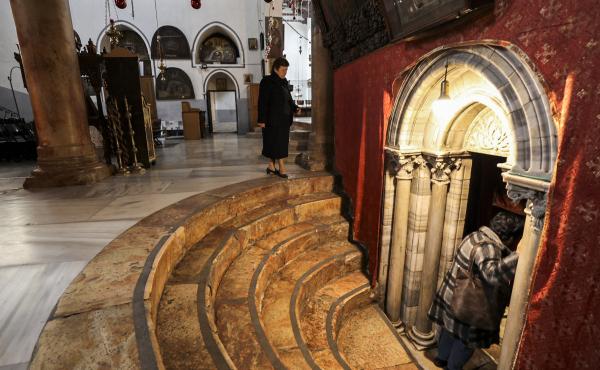 A handful of visitors tour the Church of the Nativity, traditionally believed to be the birthplace of Christ, in the biblical West Bank city of Bethlehem, on Dec. 15. A handful of visitors tour the Church of the Nativity, traditionally believed to be the birthplace of Christ, in the biblical West Bank city of Bethlehem, on Dec. 15.