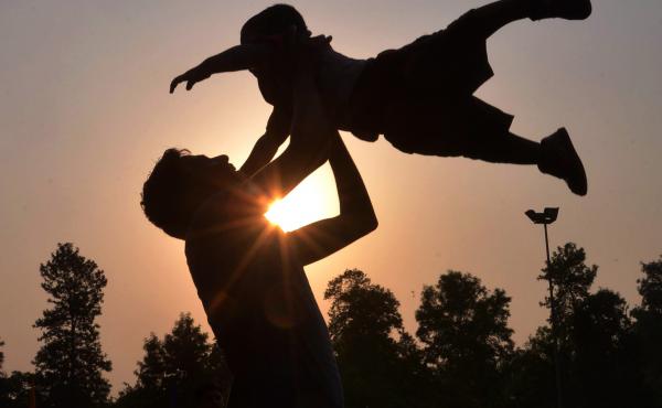 A father plays with his son at a park in Amritsar, India, on Father's Day in June 2016. A father plays with his son at a park in Amritsar, India, on Father's Day in June 2016.
