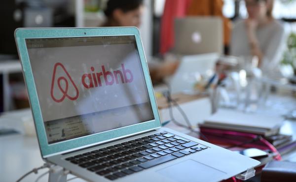 The logo of online lodging service Airbnb is shown on a screen in the Airbnb offices in Paris in 2015. The logo of online lodging service Airbnb is shown on a screen in the Airbnb offices in Paris in 2015.