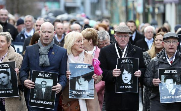 Families of victims of Bloody Sunday, in which 13 unarmed protesters were killed in 1972, marched before the prosecutor's announced charges against a former British paratrooper. Families of victims of Bloody Sunday, in which 13 unarmed protesters were killed in 1972, marched before the prosecutor's announced charges against a former British paratrooper.