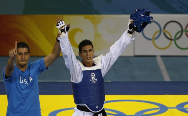 U.S. coach Jean Lopez and his brother Steven celebrate after Steven defeated Rashad Ahmadov of Azerbaijan, winning him a bronze medal in the 2008 Beijing Olympic Games. U.S. coach Jean Lopez and his brother Steven celebrate after Steven defeated Rashad Ahmadov of Azerbaijan, winning him a bronze medal in the 2008 Beijing Olympic Games.