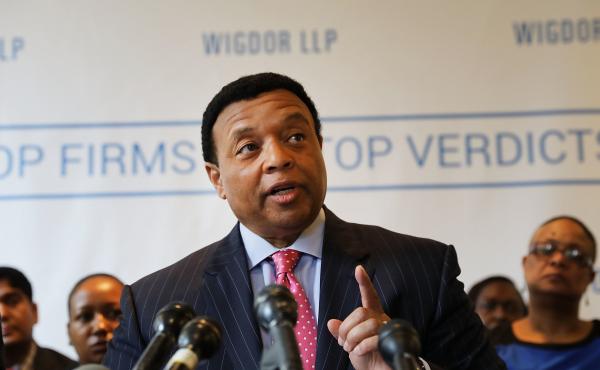 Former Fox News host Kelly Wright joins other current and former Fox employees at a news conference on April 26, 2017, in New York City. Wright alleged racial bias in failing to receive desired opportunities and promotions. Former Fox News host Kelly Wright joins other current and former Fox employees at a news conference on April 26, 2017, in New York City. Wright alleged racial bias in failing to receive desired opportunities and promotions.