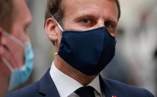 French President Emmanuel Macron, wearing a protective face mask, visits a Valeo auto parts factory in Etaples, in the north of France, late last month. French President Emmanuel Macron, wearing a protective face mask, visits a Valeo auto parts factory in Etaples, in the north of France, late last month.