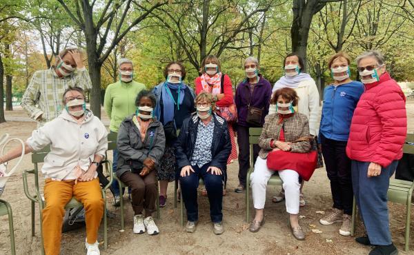Suzy Margueron (seated, center) who advocates for people with hearing loss, likes to gather with friends in Paris' Luxembourg Gardens. All have transparent masks, but say it's others who should be wearing them too. Suzy Margueron (seated, center) who advocates for people with hearing loss, likes to gather with friends in Paris' Luxembourg Gardens. All have transparent masks, but say it's others who should be wearing them too.