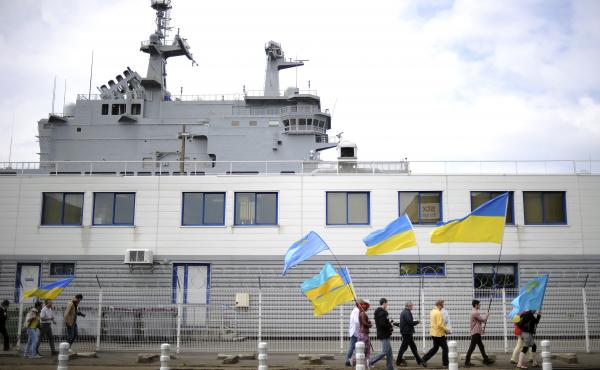 People holding Ukrainian and Crimean Tatar flags demonstrate in front of the French-built Vladivostok warship in St. Nazaire, western France, on June 1. The protesters are opposed to the sale of the Vladivostok and Sevastopol warships to Russia. People holding Ukrainian and Crimean Tatar flags demonstrate in front of the French-built Vladivostok warship in St. Nazaire, western France, on June 1. The protesters are opposed to the sale of the Vladivostok and Sevastopol warships to Russia.