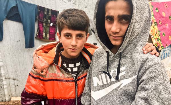 Mazen (right), 13, and his brother Mezban in a camp for displaced Yazidis in the Kurdistan region of Iraq. Mazen was freed recently, five years after being kidnapped by ISIS. He was found in Baghouz, the last ISIS stronghold in Syria. His brother was also Mazen (right), 13, and his brother Mezban in a camp for displaced Yazidis in the Kurdistan region of Iraq. Mazen was freed recently, five years after being kidnapped by ISIS. He was found in Baghouz, the last ISIS stronghold in Syria. His brother was also