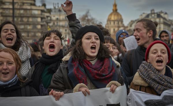 Protestors chant and sing against President Emmanuel Macron during a rally in Paris as thousands take to the streets to protest against pension reform on Tuesday. Protestors chant and sing against President Emmanuel Macron during a rally in Paris as thousands take to the streets to protest against pension reform on Tuesday.