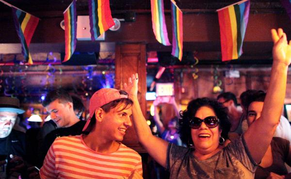 People celebrate inside the Stonewall Inn, an iconic gay bar recently granted historic landmark status, after the U.S. Supreme Court ruled same-sex couples have the right to marry in all 50 states. People celebrate inside the Stonewall Inn, an iconic gay bar recently granted historic landmark status, after the U.S. Supreme Court ruled same-sex couples have the right to marry in all 50 states.