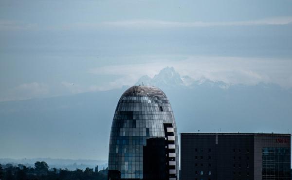 A photo taken last month by Nairobi resident Osman Siddiqi shows One Africa Place, a bullet-shaped glass high-rise in Nairobi, framed by the jagged, snowcapped peaks of Mount Kenya, which many residents said they have never seen from the capital city. A photo taken last month by Nairobi resident Osman Siddiqi shows One Africa Place, a bullet-shaped glass high-rise in Nairobi, framed by the jagged, snowcapped peaks of Mount Kenya, which many residents said they have never seen from the capital city.