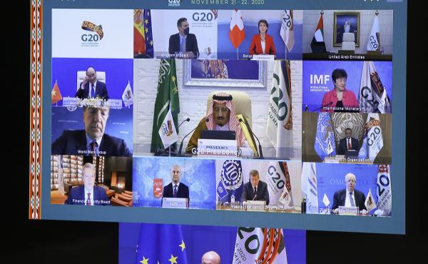 European Council President Charles Michel, on screen bottom, participates in a virtual G-20 meeting, hosted by Saudi Arabia, at the European Council building in Brussels on Saturday. European Council President Charles Michel, on screen bottom, participates in a virtual G-20 meeting, hosted by Saudi Arabia, at the European Council building in Brussels on Saturday.