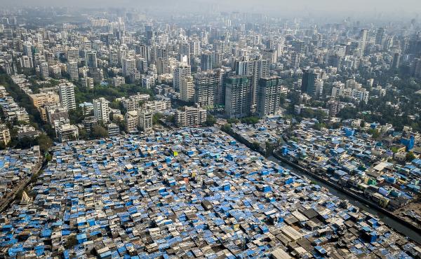 In Mumbai, some prosperous neighborhoods sit alongside slums. This year's Gates report on progress toward eliminating poverty notes that there is vast inequality not only between nations, but within many of them. In Mumbai, some prosperous neighborhoods sit alongside slums. This year's Gates report on progress toward eliminating poverty notes that there is vast inequality not only between nations, but within many of them.