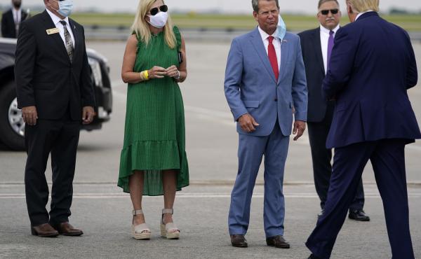 Georgia Gov. Brian Kemp (third from left) greets President Trump at Hartsfield-Jackson Atlanta International Airport on Wednesday. Georgia Gov. Brian Kemp (third from left) greets President Trump at Hartsfield-Jackson Atlanta International Airport on Wednesday.