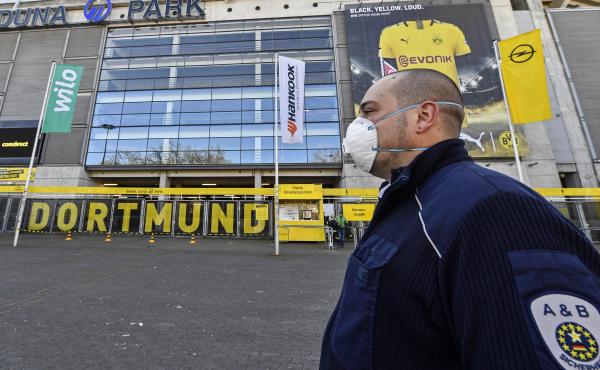 Security with face masks stand in front of the Signal Iduna Park, where a temporary coronavirus treatment center opened in Dortmund, Germany, Saturday. Germany has the fourth-most COVID-19 cases in the world and demand for medical supplies has skyrocketed Security with face masks stand in front of the Signal Iduna Park, where a temporary coronavirus treatment center opened in Dortmund, Germany, Saturday. Germany has the fourth-most COVID-19 cases in the world and demand for medical supplies has skyrocketed