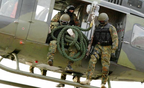 Soldiers of the Command Special Forces (KSK) of the Bundeswehr are preparing to rappel from a helicopter during an exercise in 2004. Soldiers of the Command Special Forces (KSK) of the Bundeswehr are preparing to rappel from a helicopter during an exercise in 2004.