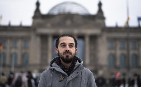 Tareq Alaows stands in front of the Bundestag, Germany's parliament, in Berlin. Alaows came to Germany as an asylum-seeker from Syria in 2015. He launched a campaign to run in Germany's federal election in September for the Green Party but recently withdr Tareq Alaows stands in front of the Bundestag, Germany's parliament, in Berlin. Alaows came to Germany as an asylum-seeker from Syria in 2015. He launched a campaign to run in Germany's federal election in September for the Green Party but recently withdr