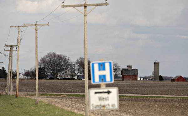 A road sign for a nearby hospital along a rural road outside Sandwich, Ill., in April. A road sign for a nearby hospital along a rural road outside Sandwich, Ill., in April.