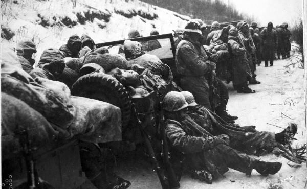 Marines of the 5th and 7th regiments who hurled back a surprise onslaught by three Chinese communist divisions wait to withdraw from the Chosin Reservoir area circa December 1950. Marines of the 5th and 7th regiments who hurled back a surprise onslaught by three Chinese communist divisions wait to withdraw from the Chosin Reservoir area circa December 1950.