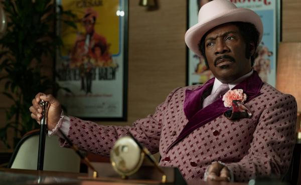 In Dolemite Is My Name, Eddie Murphy leads the star-studded biopic about Rudy Ray Moore, whose iconic alter ego became a blaxploitation legend. In Dolemite Is My Name, Eddie Murphy leads the star-studded biopic about Rudy Ray Moore, whose iconic alter ego became a blaxploitation legend.