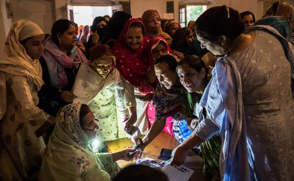 Pakistani women jostle to receive their ballot papers prior to casting their ballot at a polling station on May 11, 2013 in Lahore. A study in The Lancet provides evidence that free and fair elections are associated with a lower burden of chronic diseases Pakistani women jostle to receive their ballot papers prior to casting their ballot at a polling station on May 11, 2013 in Lahore. A study in The Lancet provides evidence that free and fair elections are associated with a lower burden of chronic diseases