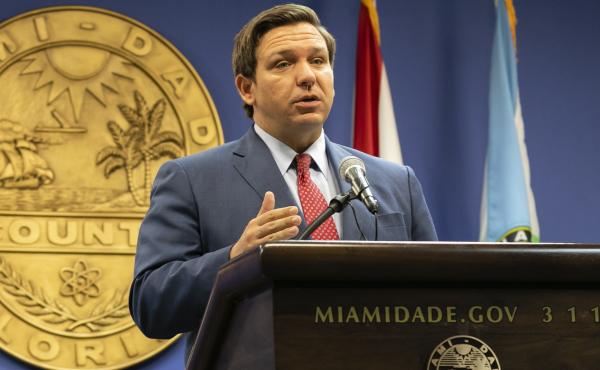 Florida Gov. Ron DeSantis, here in June, said this week that the state's troubled unemployment portal was designed to discourage people applying for benefits. The portal launched in 2013 under then-Gov. Rick Scott, now a U.S. senator. Florida Gov. Ron DeSantis, here in June, said this week that the state's troubled unemployment portal was designed to discourage people applying for benefits. The portal launched in 2013 under then-Gov. Rick Scott, now a U.S. senator.