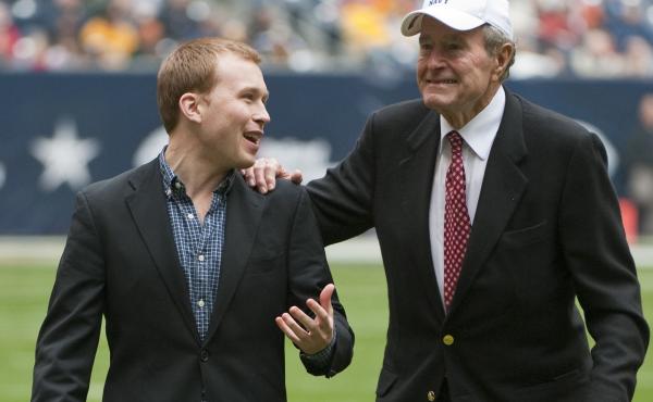 Former United States president George H. W. Bush, right, leaves the field with the help of Pierce Bush, his grandson, before the Texas Bowl NCAA college football game in 2009 in Houston. Former United States president George H. W. Bush, right, leaves the field with the help of Pierce Bush, his grandson, before the Texas Bowl NCAA college football game in 2009 in Houston.