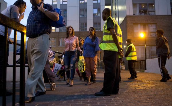 Officials evacuate residents of the Chalcots Estate, in London's Camden borough on Friday evening. Camden's local council decided to evacuate the hundreds of households due to safety concerns following the devastating fire that killed 79 people in Grenfel Officials evacuate residents of the Chalcots Estate, in London's Camden borough on Friday evening. Camden's local council decided to evacuate the hundreds of households due to safety concerns following the devastating fire that killed 79 people in Grenfel
