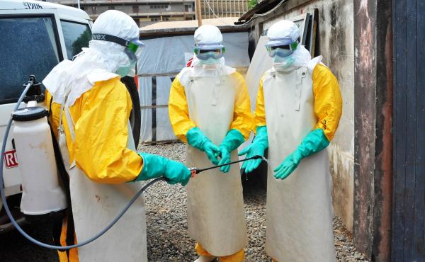 In a photo from Guinea's previous Ebola outbreak, medical staff clean their protection suits in March 2015 in Conakry, Guinea. Guinean authorities declared a new Ebola outbreak Sunday. In a photo from Guinea's previous Ebola outbreak, medical staff clean their protection suits in March 2015 in Conakry, Guinea. Guinean authorities declared a new Ebola outbreak Sunday.