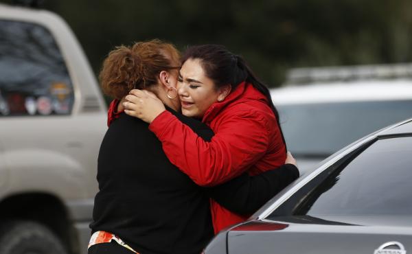 Vanessa Flores (right) embraces another woman Friday after she leaves the locked-down Veterans Home of California in Yountville, Calif., during a hostage situation. Law enforcement officers found a gunman and three hostages dead after a lengthy standoff. Vanessa Flores (right) embraces another woman Friday after she leaves the locked-down Veterans Home of California in Yountville, Calif., during a hostage situation. Law enforcement officers found a gunman and three hostages dead after a lengthy standoff.