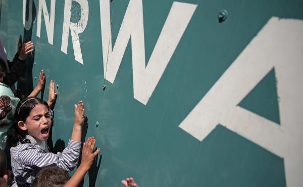 A Palestinian schoolgirl protests against a funding gap at the U.N. Relief and Works Agency in Gaza City, in 2015. A Palestinian schoolgirl protests against a funding gap at the U.N. Relief and Works Agency in Gaza City, in 2015.
