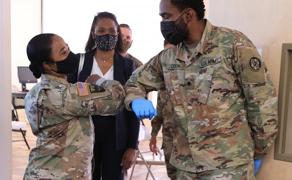 Nearly 130 million U.S. adults have completed their vaccine regimens, the CDC says, with another 70 million vaccine doses currently in the distribution pipeline. Here, Maryland National Guard Brig. Gen. Janeen Birckhead greets soldiers last week at a mobi Nearly 130 million U.S. adults have completed their vaccine regimens, the CDC says, with another 70 million vaccine doses currently in the distribution pipeline. Here, Maryland National Guard Brig. Gen. Janeen Birckhead greets soldiers last week at a mobi